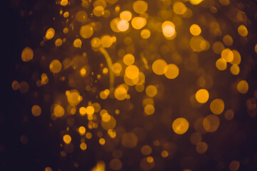 Abstract gold defocus bokeh glitter vintage lights with black
