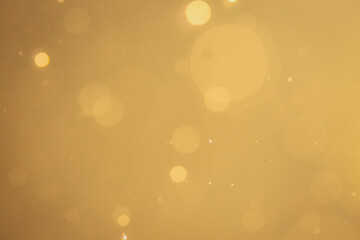 Dark Abstract Gold bokeh sparkle on black background