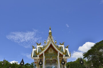 Fototapeta premium Beautiful Thai sculpture with blue sky background at Wat Aran Banphot Sri Chiang Mai District. Nong Khai Province, Thailand. 
