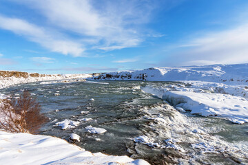 Picturesque winter landscape view of Urridafoss waterfall in Iceland.