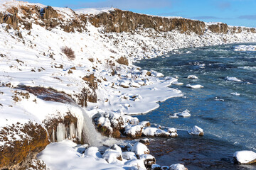 Picturesque winter landscape view of Urridafoss waterfall in Iceland.