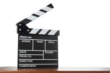Movie clapperboard on table on white isolated background