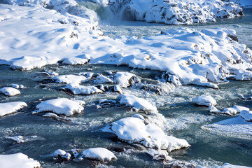 Picturesque winter landscape view of Urridafoss waterfall in Iceland.