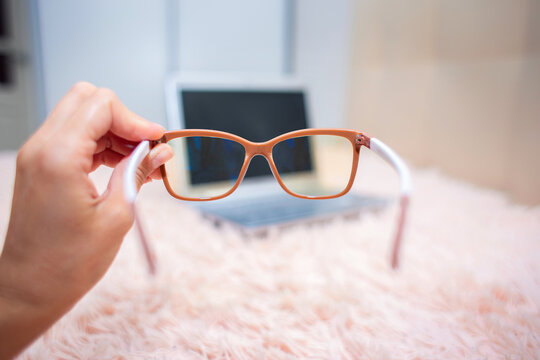View of a laptop through special glasses for working on a computer.