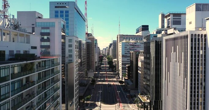 Flying over Paulista avenue during the covid 19 quarantine, empty streets on the financial center of Sao Paulo, Brazil.