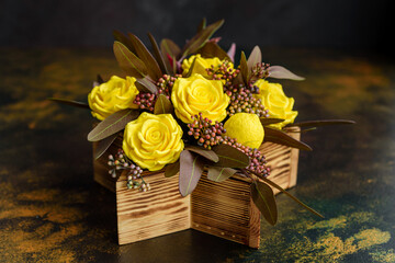 Bouquet of beautiful bright yellow rose flowers in a gift box