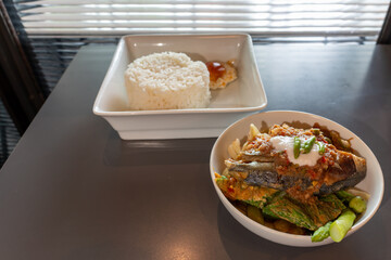 Thai style cooked vegetable salad with fried fish and shrimp paste dressing served with rice. (Mackerel Chili Paste)