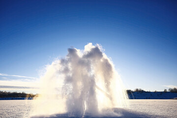 Snow geyser beating with great force