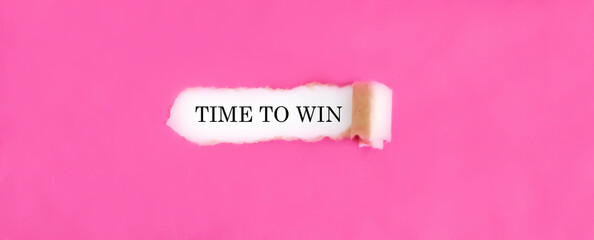 The text TIME TO WIN appearing behind torn pink paper.