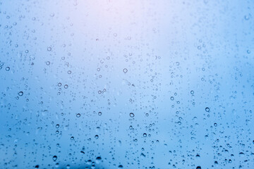 Rain on the window, natural skin of the rain The natural form of rainwater on a sky background.