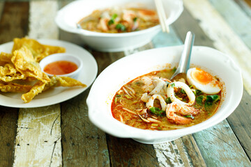 Spicy seafood soup with noodle and boiled egg