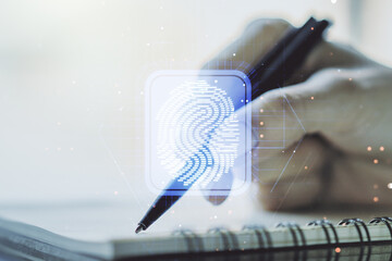 Double exposure of abstract creative fingerprint hologram with woman hand writing in notepad on background, protection of personal information concept