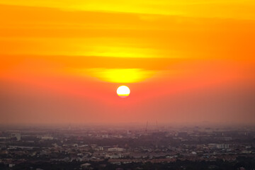 Sunrise sunset in the city with selective focus on the sun