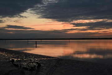 Long exposure golden sunset over Breydon Water, a stretch of the River Yare at Great Yarmouth, Norfolk, UK