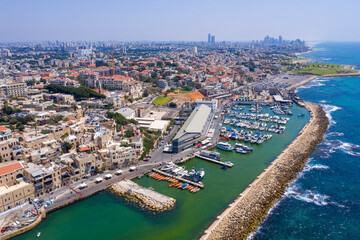 Obraz premium Aerial view of Jaffa old city port with marina coastline and general view of both Jaffa and Tel Aviv. 