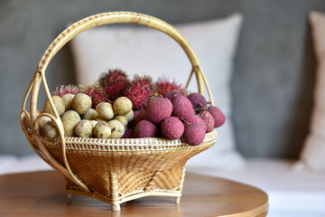 Assorted fruites on bamboo basket (banana, lychee, rambutan and  longkong) fruit health food. or a...