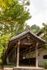 Fototapeta na wymiar Entrance of cloister to the main building of Yotaku-ji temple in Sanda city, Hyogo, Japan