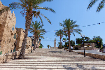 Fototapeta na wymiar Jaffa old city empty streets during Corona virus days with the Church of Sail Peter building.