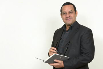 Portrait of Indian businessman in suit with book