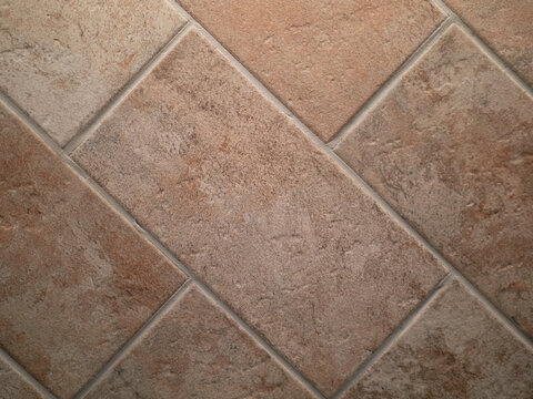 closeup of terracotta flooring after restoration, with rectangular tiles