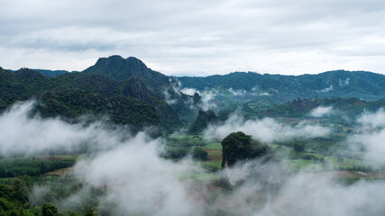Landscape image of foggy greenery rainforest mountains and hills