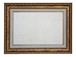 Old vintage golden wood picture frame with blank white canvas