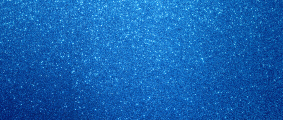 blue glitter christmas background. Close-up shot of glittery texture or new year or valentine day designs.