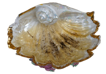 dirty broken glass ashtray made in the shape of a sea shell isolated