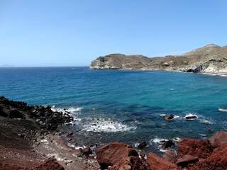 Natural landscape of Red Beach in Akrotiri on Santorini Island, Greece. Red Beach is famed for its titular red-hued sand, and is a noted for being popular tourist attraction.
