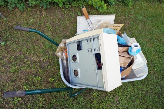  Old rubbish and computer are taken out on a wheelbarrow