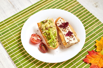 Fototapeta na wymiar Toasted baguette with avocado and cheese.