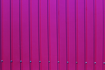 Abstract purple texture background. Red wall background. Striped background. Colorful fence, cropped shot. 