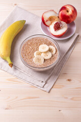 a portion of morning granola porridge served on rustic wooden surface