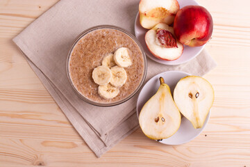 a portion of morning granola porridge served on rustic wooden surface