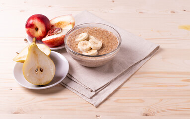 a portion of morning granola porridge served on rustic wooden surface