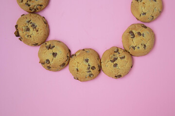 chocolate cookies on a pink background