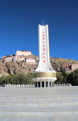 View of Gyantse Dzong, also known Gyangze Castle built on a huge spur of grey brown rock in Tibet,...