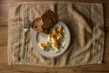 Closeup of white plate with hard boiled eggs. Breakfast food