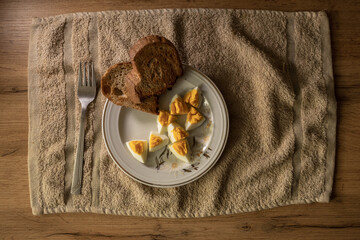 Closeup of white plate with hard boiled eggs. Breakfast food