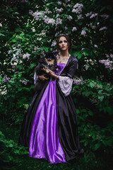 Fototapeta premium Lady in black and purple baroque dress