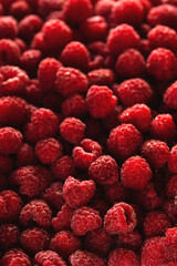 Lots of red ripe raspberries in water drops. Raw summer berries texture and background. Healthy food and vitamins concept.