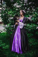 Fototapeta premium Lady in black and purple baroque dress