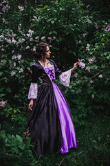 Fototapeta premium Lady in black and purple baroque dress