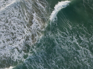 Aerial photo of a small surf break off the coast of New Zealand. 