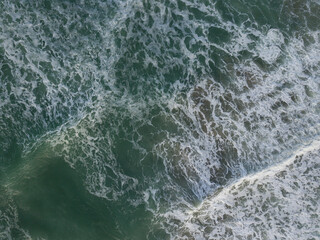 Aerial photo of a small surf break off the coast of New Zealand. 