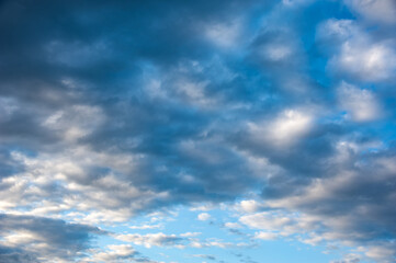 Fototapeta premium Natural sky composition. Sunny vast blue sky abstract background. Beautiful cloudscape, view over white fluffy clouds. Freedom concept, on the heaven. Element of design.