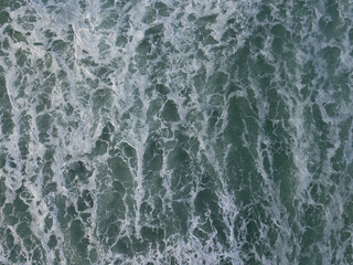 Aerial photo of a small surf break off the coast of New Zealand. 