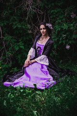 Fototapeta premium Lady in black and purple baroque dress