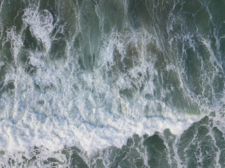Aerial photo of a small surf break off the coast of New Zealand. 