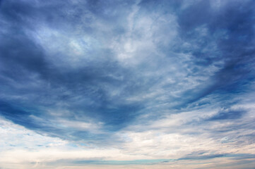 Fototapeta premium Natural sky composition. Dark ominous colorful storm rain clouds. Dramatic sky. Overcast stormy cloudscape. Thunderstorm. Element of apocalypse design. Toned.